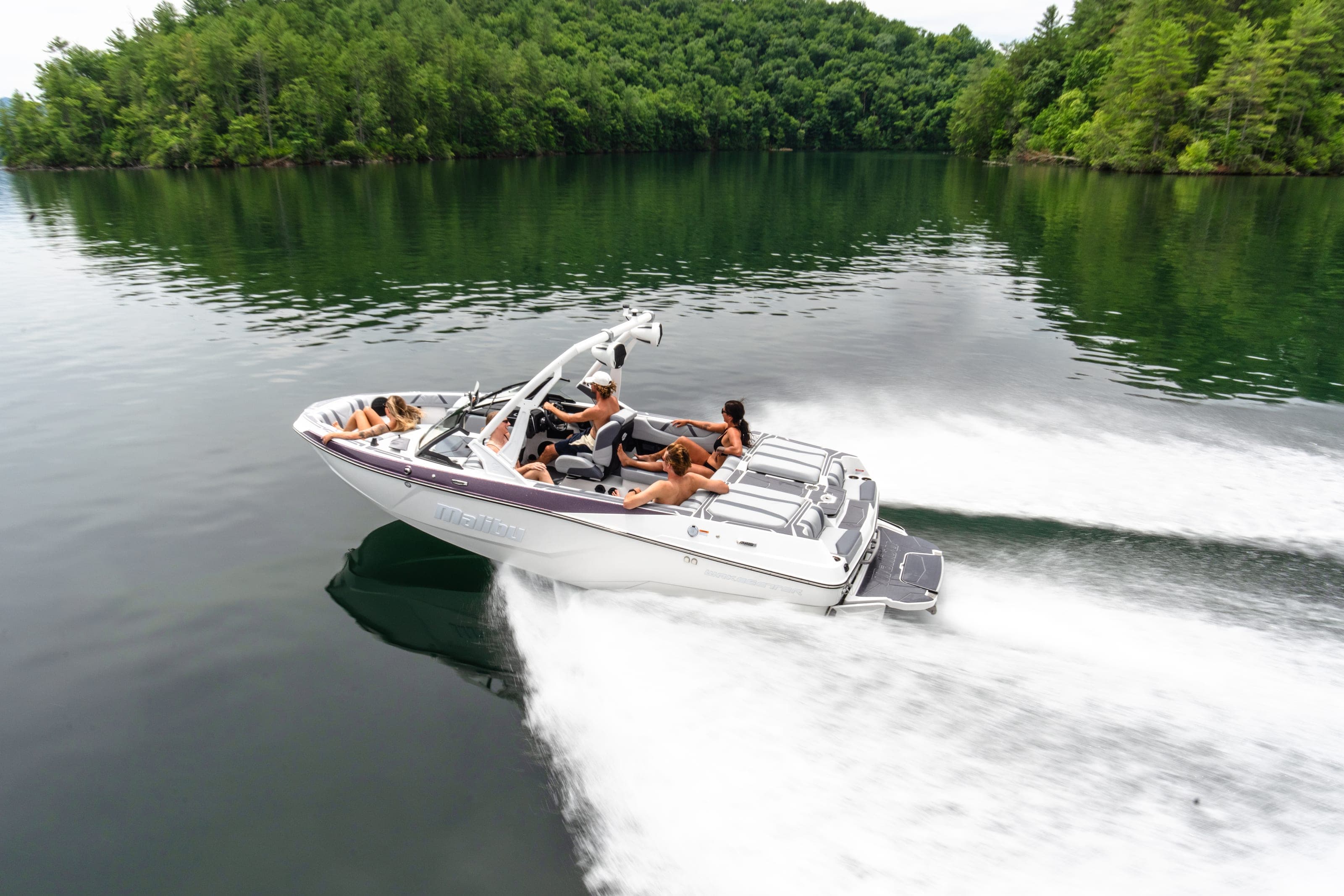 A Malibu 20 VTX at speed, people aboard