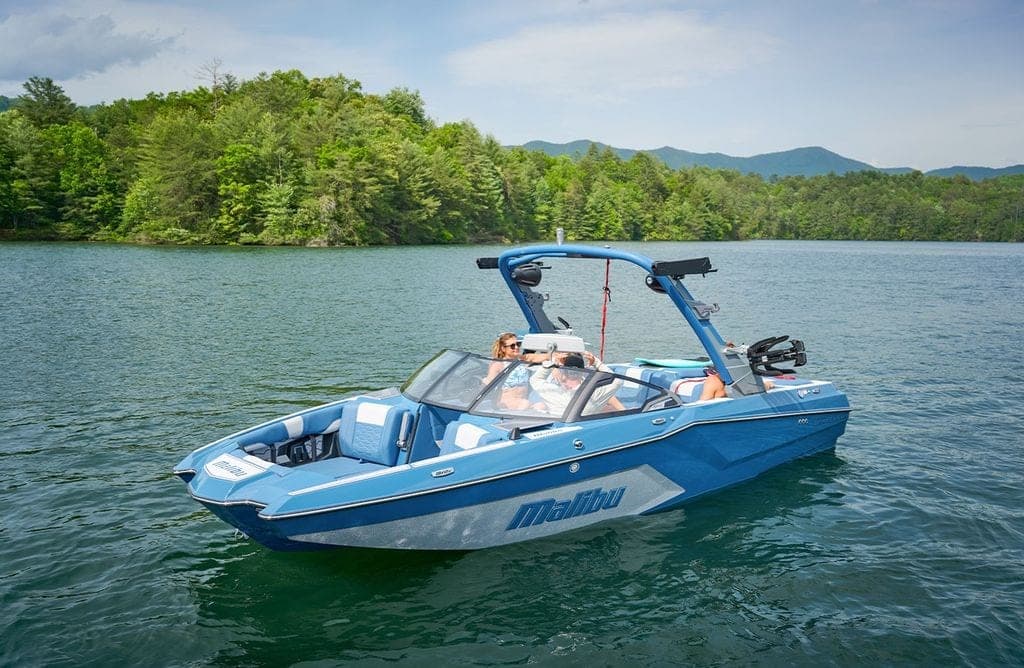 A Malibu 22 MXZ on a lake