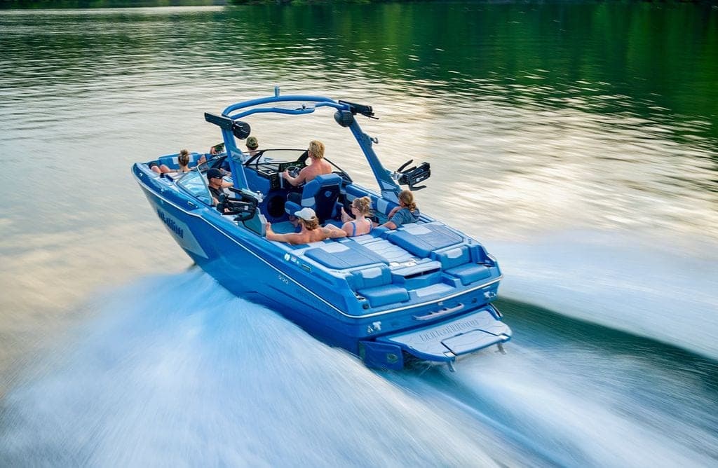 A Malibu 22 MXZ from above and behind, at speed