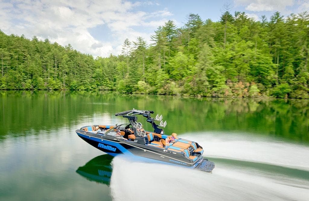 A Malibu 24 MXZ at speed on a lake