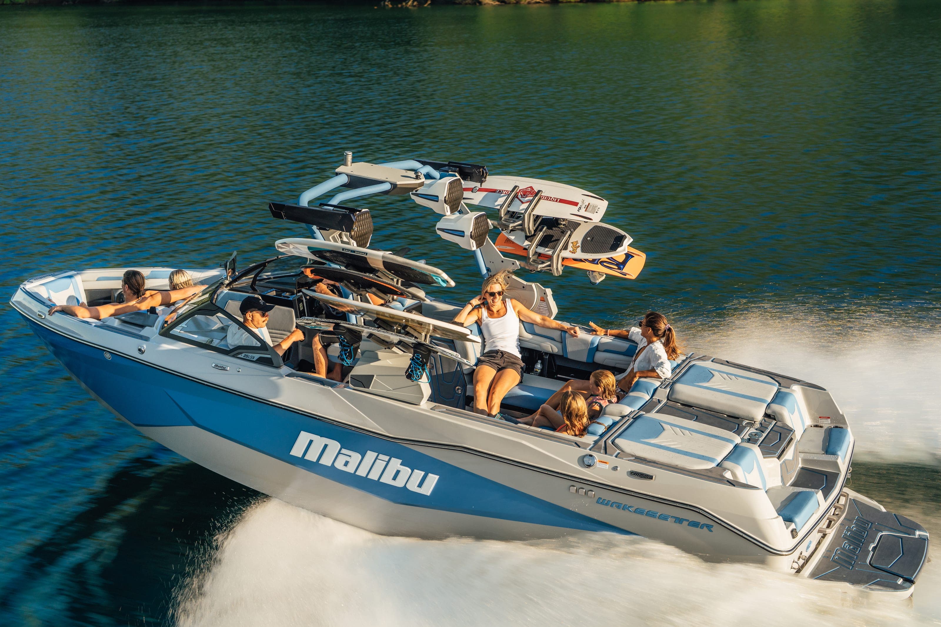 A Malibu 25 LSV at speed, friends aboard