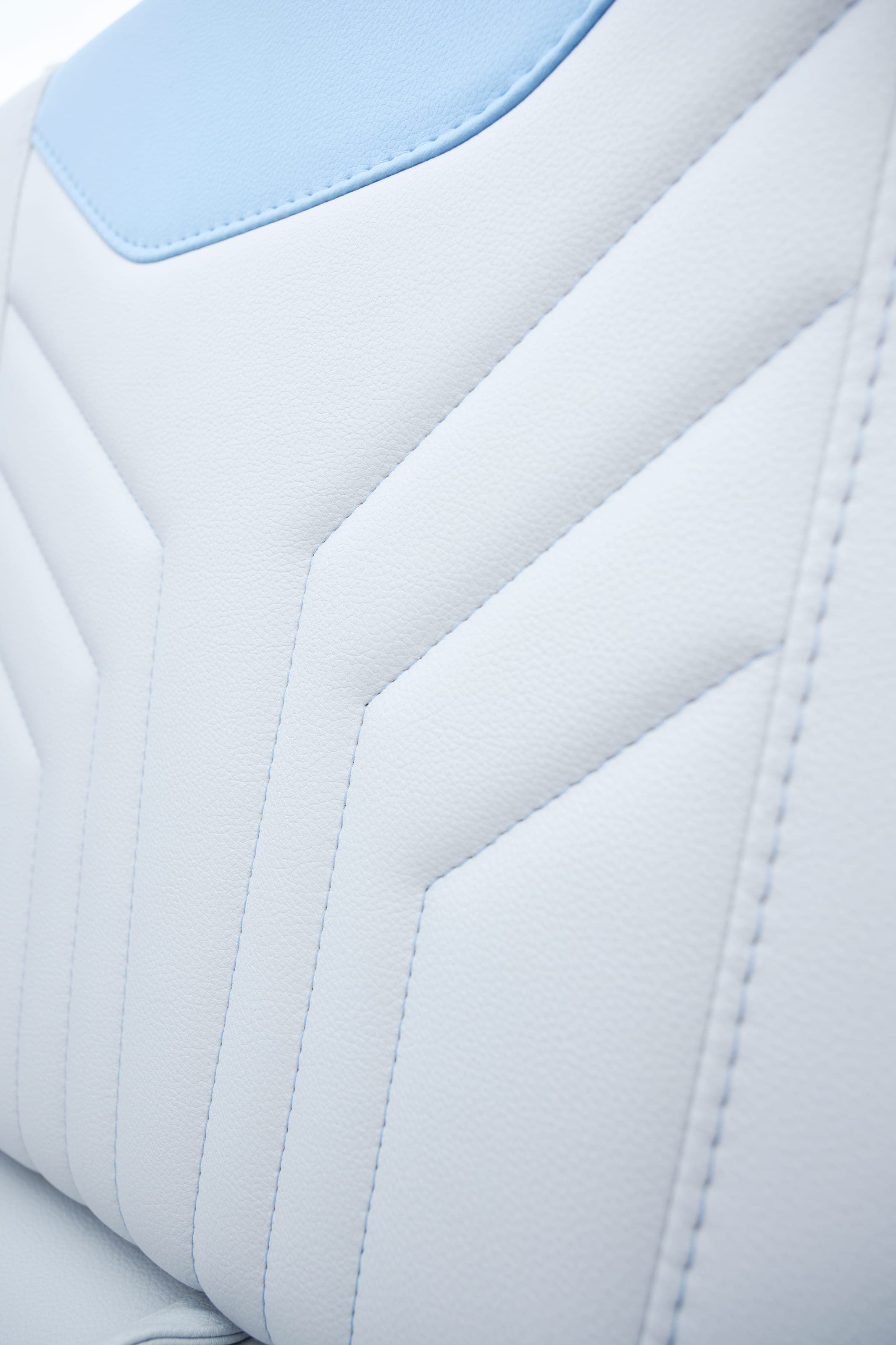 Stitched white upholstery on a Malibu 25 LSV seat