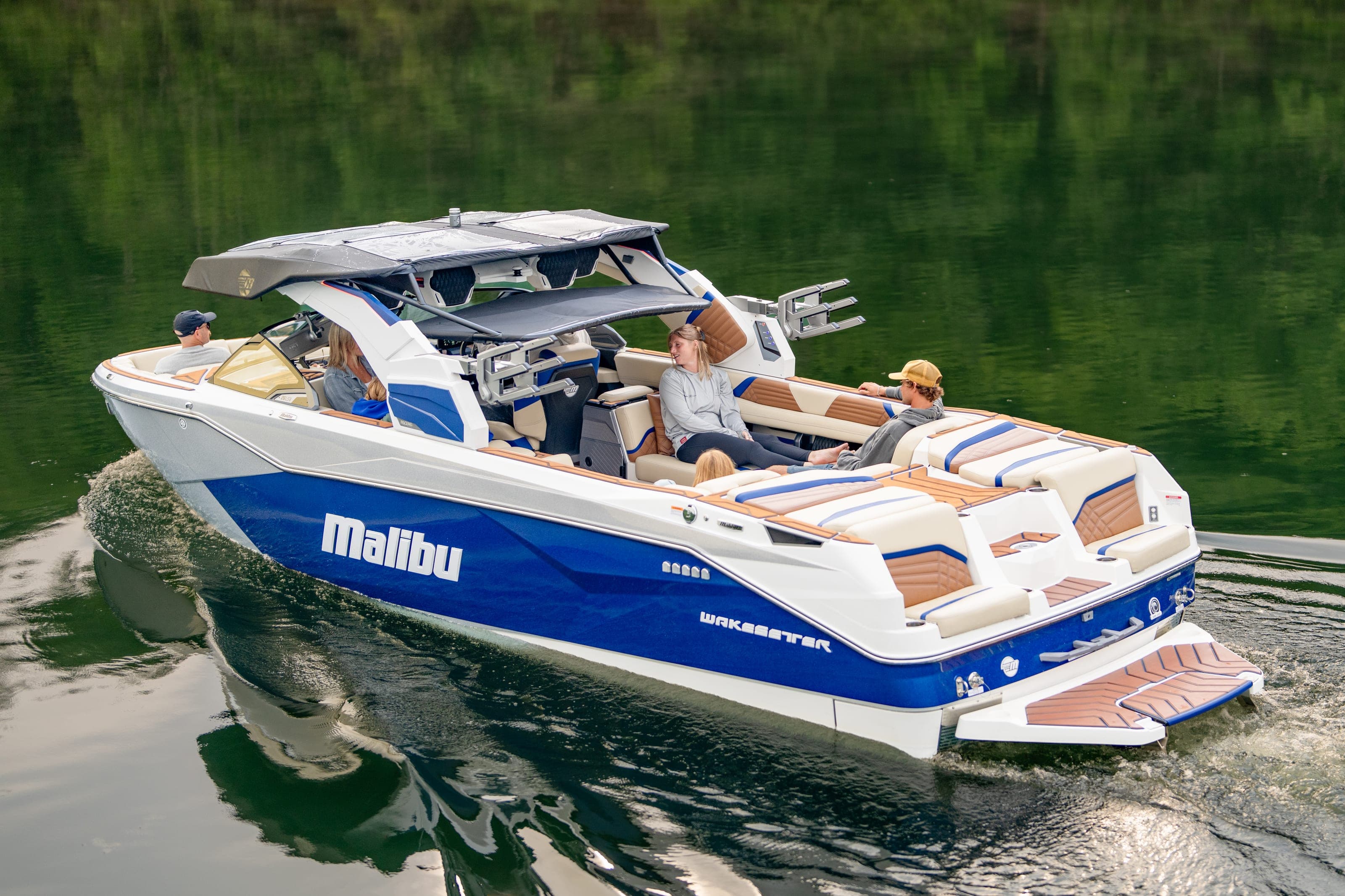 A Malibu 26 LSV under way seen from above, people aboard
