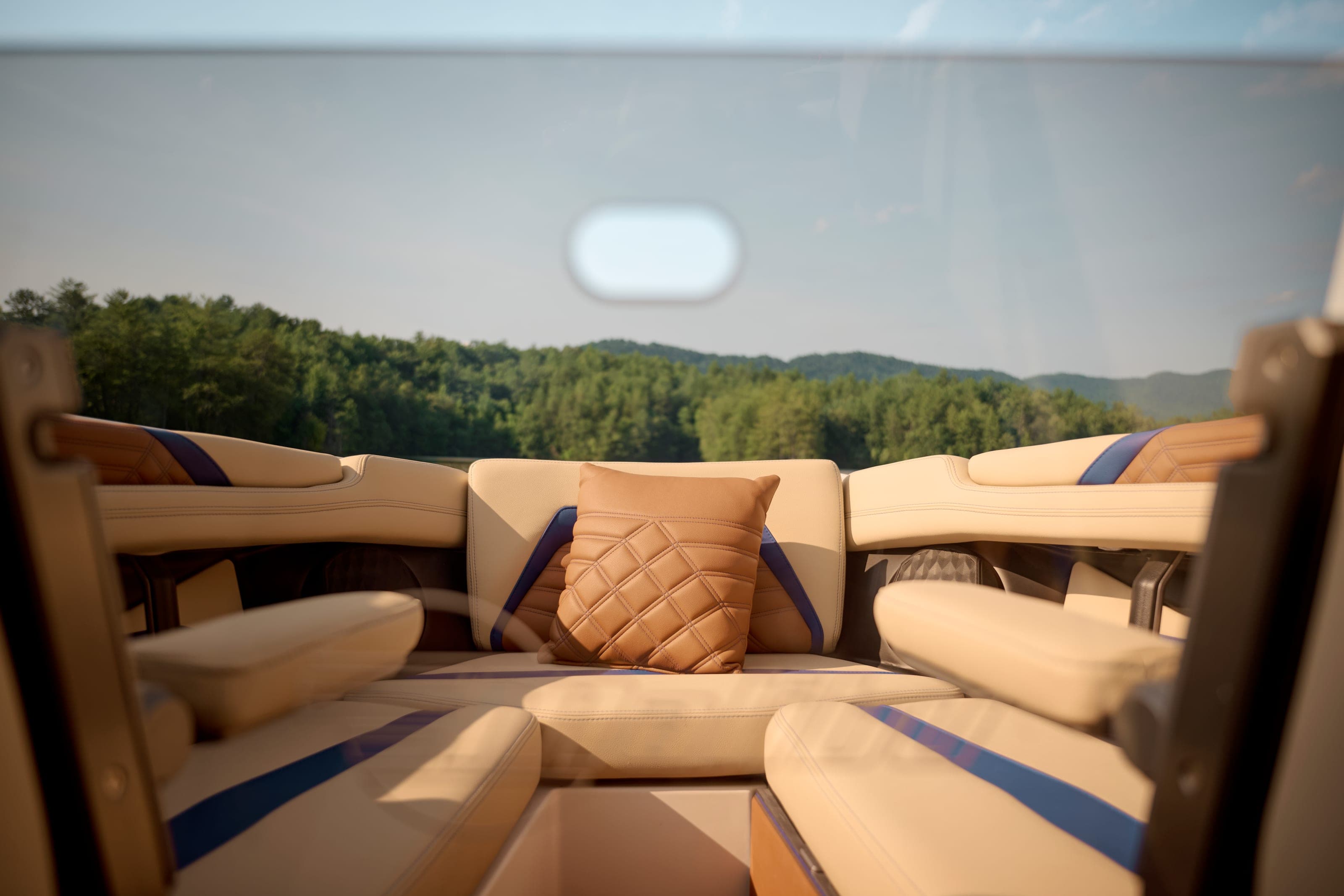 The bow seating of a Malibu 26 LSV, looking forward over the cushions