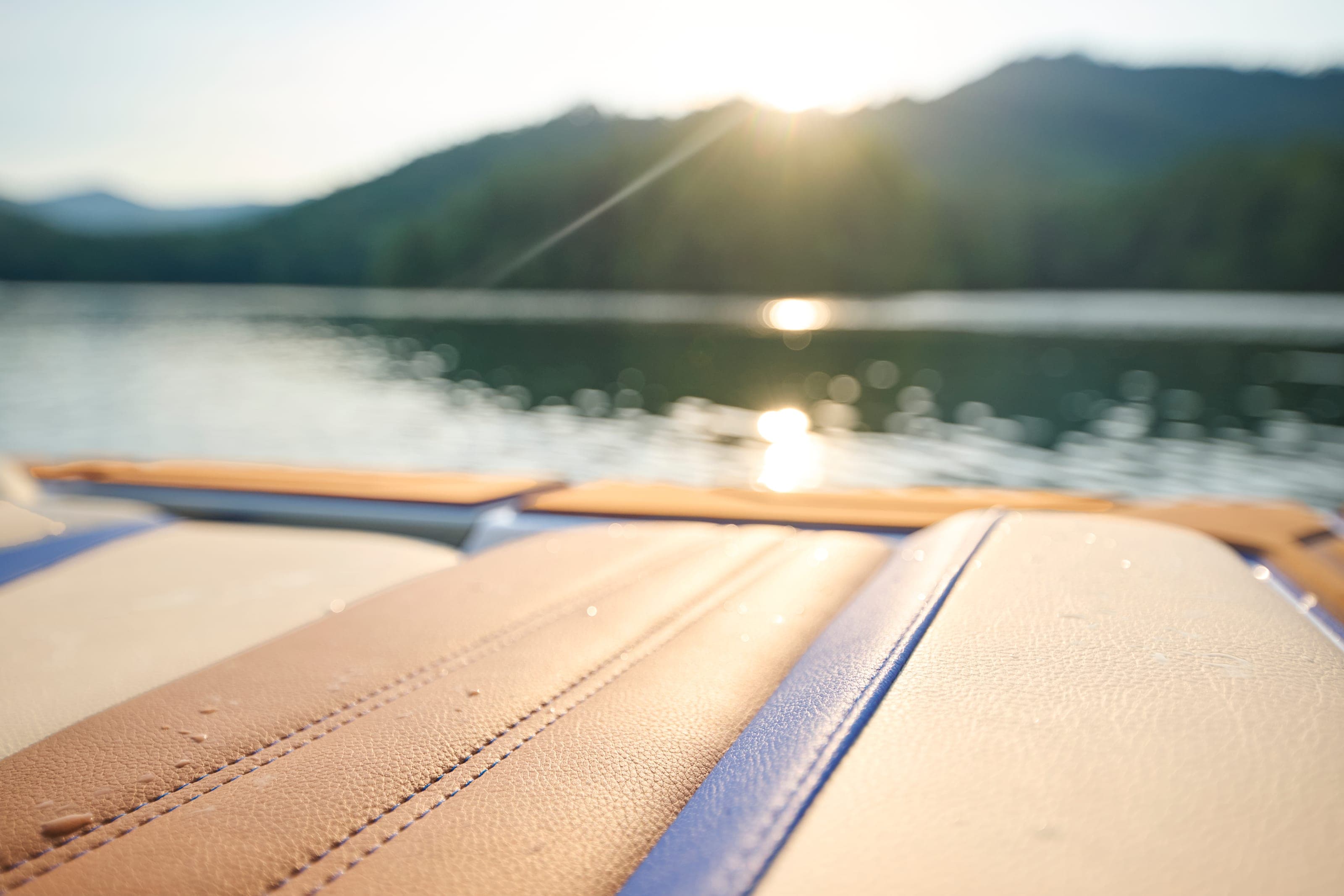 Upholstery detail of a Malibu 26 LSV in the low sun, the water beyond