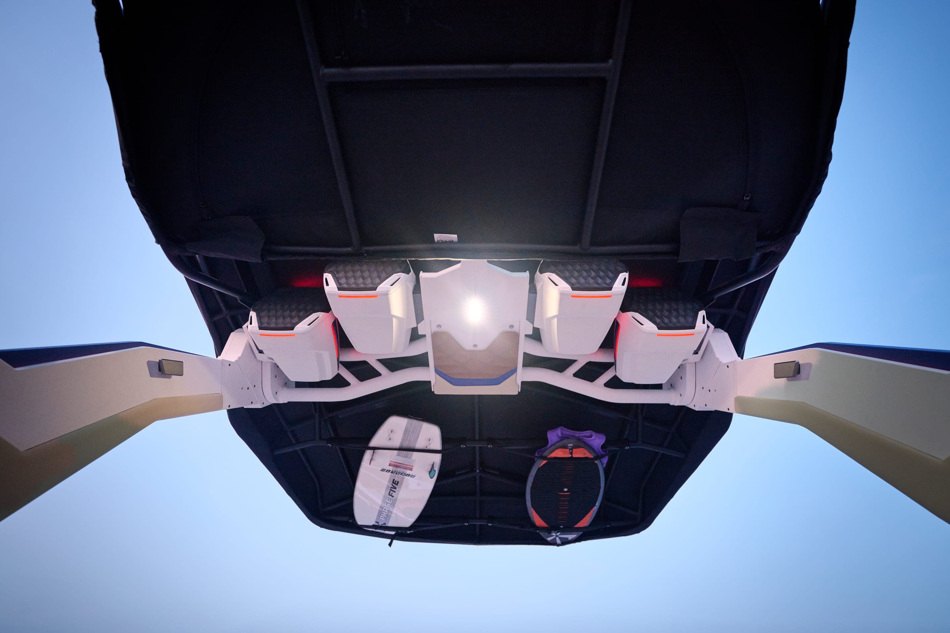 Looking up at the tower of a Malibu 26 LSV, with its lights and speakers
