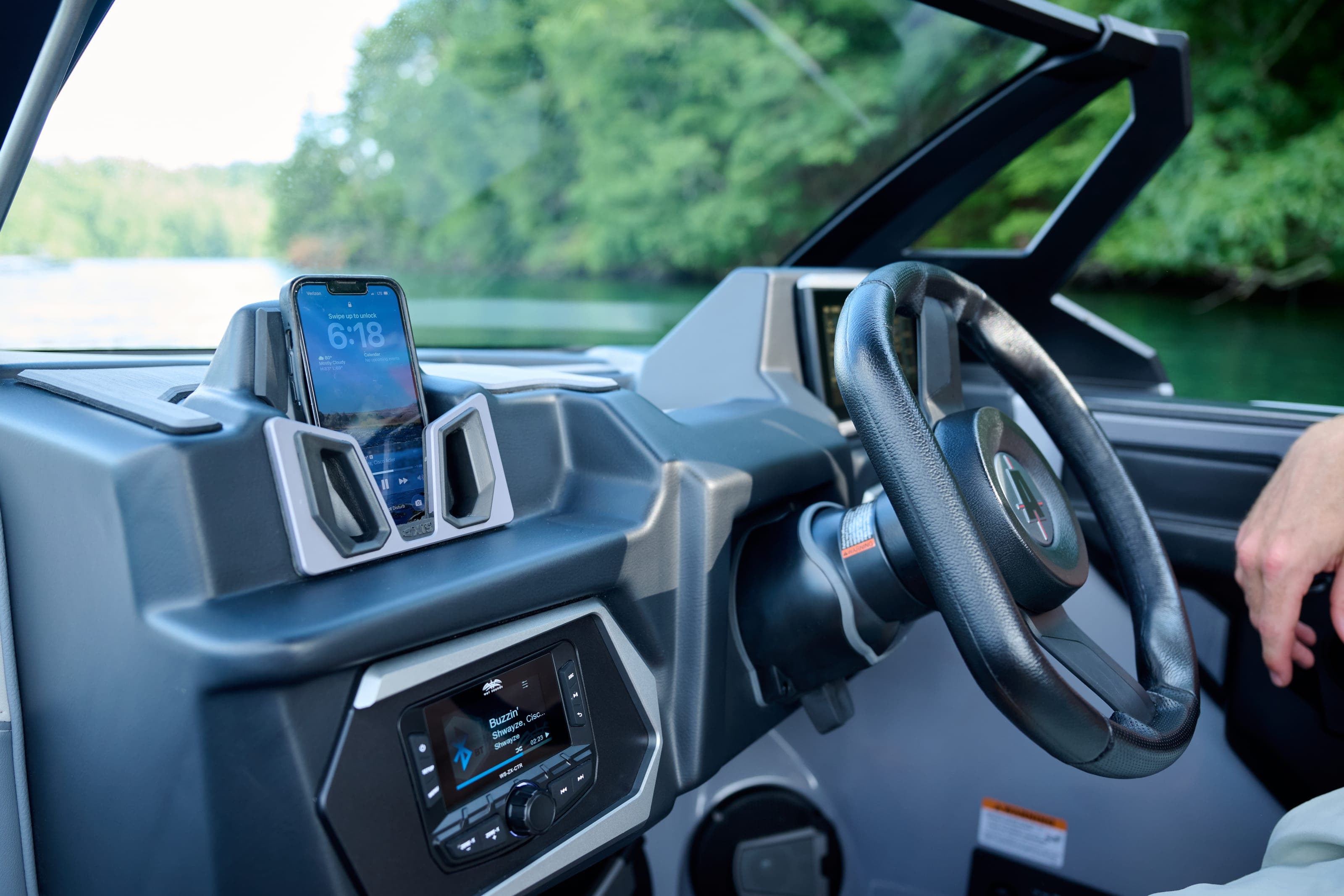 The helm of an Axis T220 with steering wheel and screen
