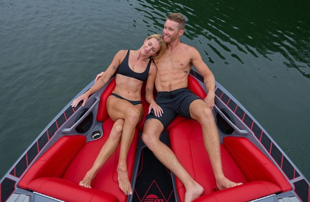 Two people in the bow of a Malibu Response TXi